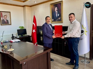 BURHANİYE KAYMAKAMI CUMALİ ATİLLA’YA TANJU COŞGUN’DAN HAYIRLI OLSUN ZİYARETİ